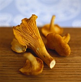 Chanterelles on wooden table