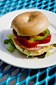 Bagel with pepper and tomato