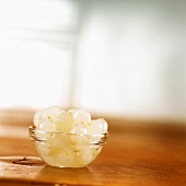 Pearl onions in small glass dish