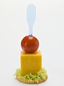 Cheese and cherry tomato on cracker