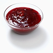 Red fruit compote in a glass bowl