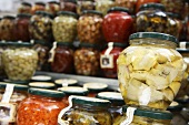 Jars of pickled vegetables on a market stall