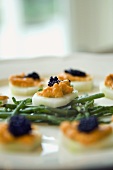 Vegetable appetisers with fish paste, caviar and seaweed