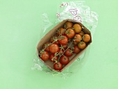 Cocktail tomatoes in a cardboard container