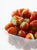 Strawberries in a plastic punnet (detail)