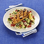Grilled chicken breast on couscous salad