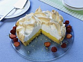 Lemon meringue pie garnished with fresh berries