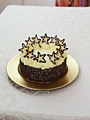 Cream cake with chocolate sprinkles and stars