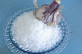 Sea salt and garlic in glass dish