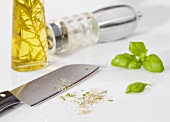 Kitchen knife with ground pepper, basil and pepper mill