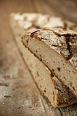 A halved loaf of rye bread