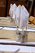 Laid table with napkins in glasses