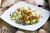 Grilled scallops on a vegetable and mango salad