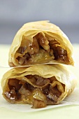 Puff pastry rolls with pecans, raisins and honey