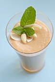 Papaya and coconut smoothie with almonds