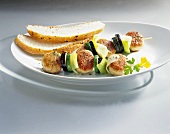 Chicken meatball kebabs with vegetables and bread