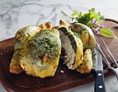 Spring chicken with a spinach and ricotta filling and herbs