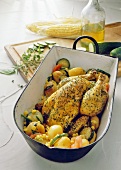 Herb chicken with vegetables in a roasting dish