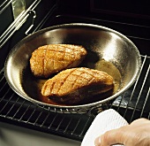 Fried duck breast in a pan in the oven