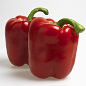 Two fresh, red peppers
