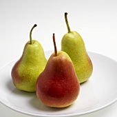 Three fresh pears on a plate