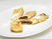 Pancakes filled with chocolate hazelnut spread