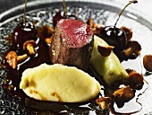 Venison medallions with peppered cherry jus and chanterelles