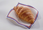 Fresh croissant on a napkin