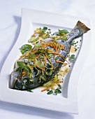 Sea bream with leeks, carrots and herbs