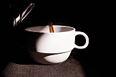 Coffee Pouring into a White Coffee Mug