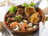 Assorted tapas (Moorish chicken, seafood salad, meatballs)