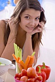 Girl with fresh vegetables