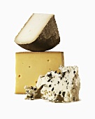 Three Assorted Cheeses on a White Background