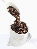 Pouring coffee beans into a bag