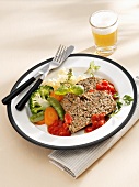 Herbed meatloaf with tomato sauce and vegetables