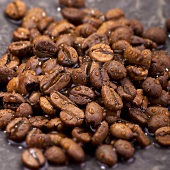 Coffee beans with drops of water