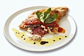 Calzone with mozzarella and sausage filling and tomato sauce