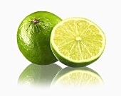 Whole lime and half a lime with reflection