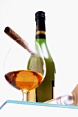 Glass of cognac, cigar and bottle of cognac
