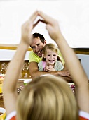 Father and children at breakfast table