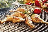 Barbecued chicken legs with rosemary and tomato