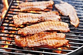Marinated belly pork on barbecue