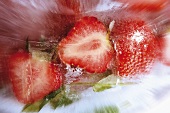 Strawberries in block of ice (close-up)