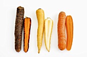 Various types of carrots, whole and halved