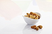 Cashews in and beside bowl