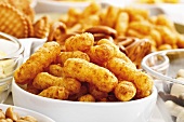 Assorted snacks, peanut puffs in bowl, close-up