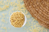 Rice in bowl by table mat