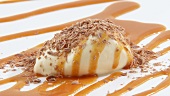 White chocolate mousse with caramel sauce & grated chocolate