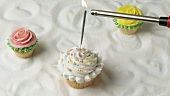 Sparkler on muffin with meringue topping, rose muffins