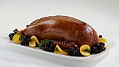 Roast duck with grapes and oranges
